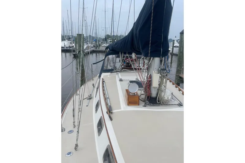 Slide: The Image of 1982 O'Day 34 sailboat docked at marina, featuring deck and rigging. - 16