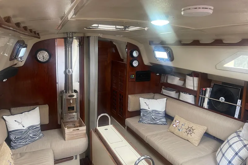 Slide: The Image of Interior of 1982 O'Day 34 sailboat with cozy seating and nautical decor. - 28