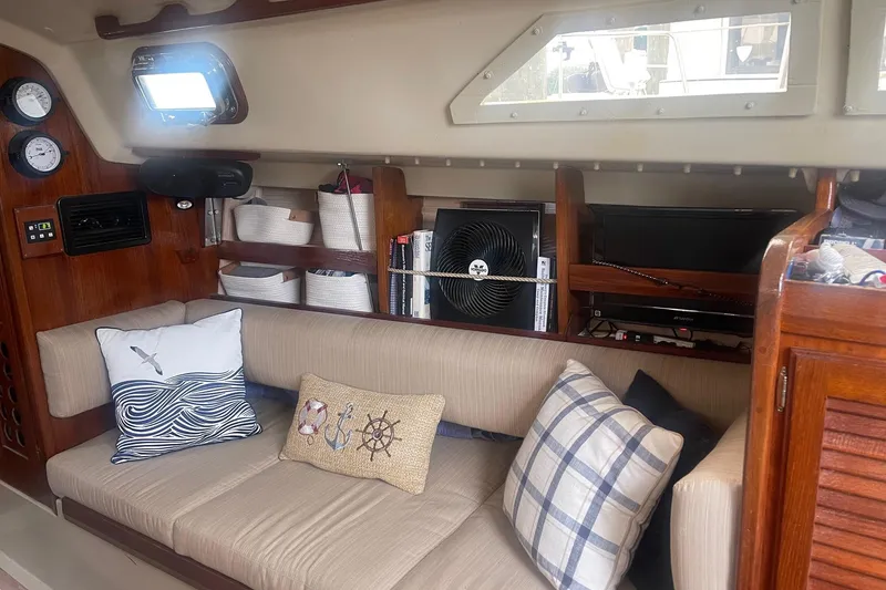 Slide: The Image of Interior of 1982 O'Day 34 sailboat with cozy seating and nautical decor. - 29