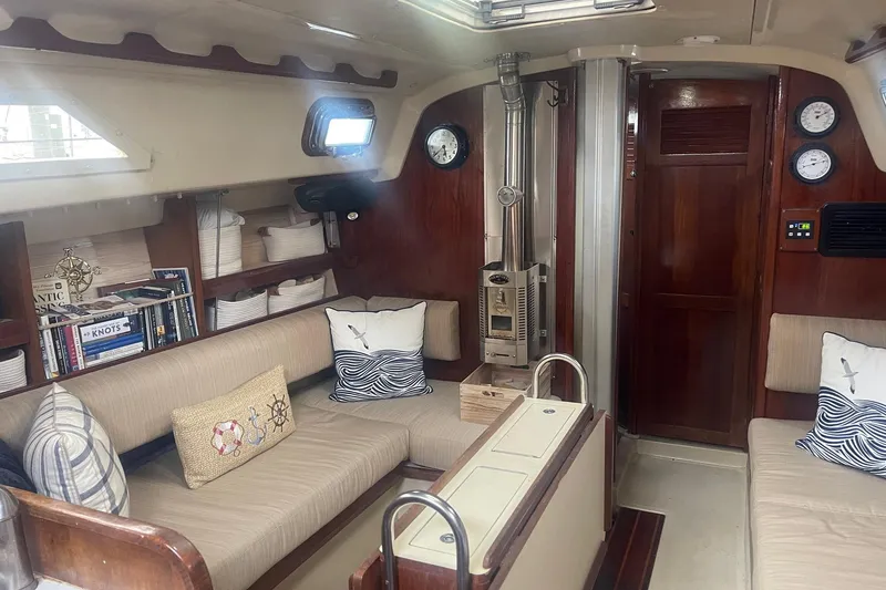 Slide: The Image of Interior of 1982 O'Day 34 sailboat with cozy seating and nautical decor. - 30