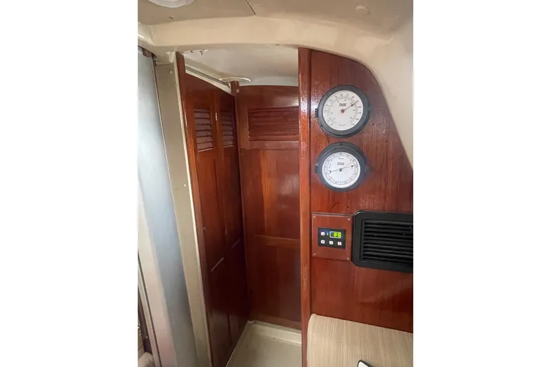 Slide: The Image of Interior of 1982 O'Day 34 sailboat with wooden paneling and gauges. - 35