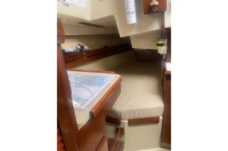 Slide: The Image of 1982 O'Day 34 sailboat interior with navigation table and cozy berth. - 40