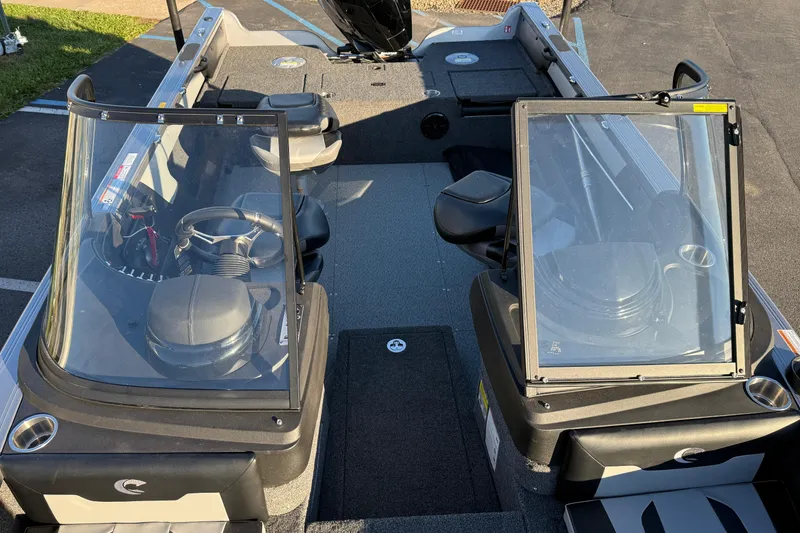 Slide: The Image of 2026 Crestliner 1850 Super Hawk interior with dual consoles and seating. - 11