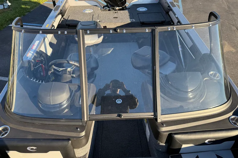 Slide: The Image of 2026 Crestliner 1850 Super Hawk boat interior with windshield and seating. - 12