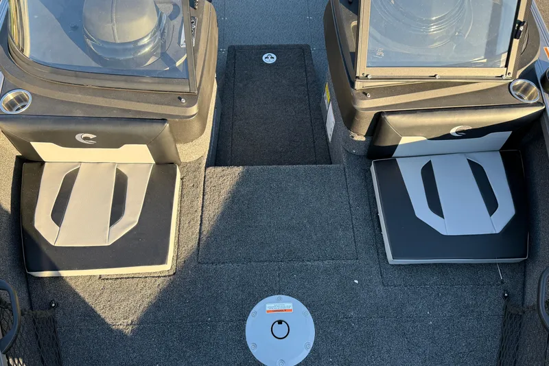 Slide: The Image of Interior view of 2026 Crestliner 1850 Super Hawk boat, featuring dual seats and carpeted flooring. - 14