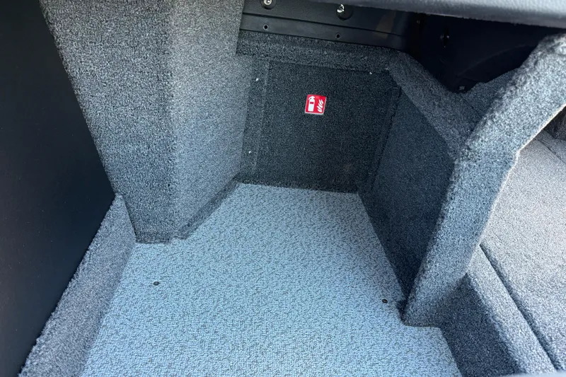 Slide: The Image of Interior view of 2026 Crestliner 1850 Super Hawk boat storage compartment. - 18