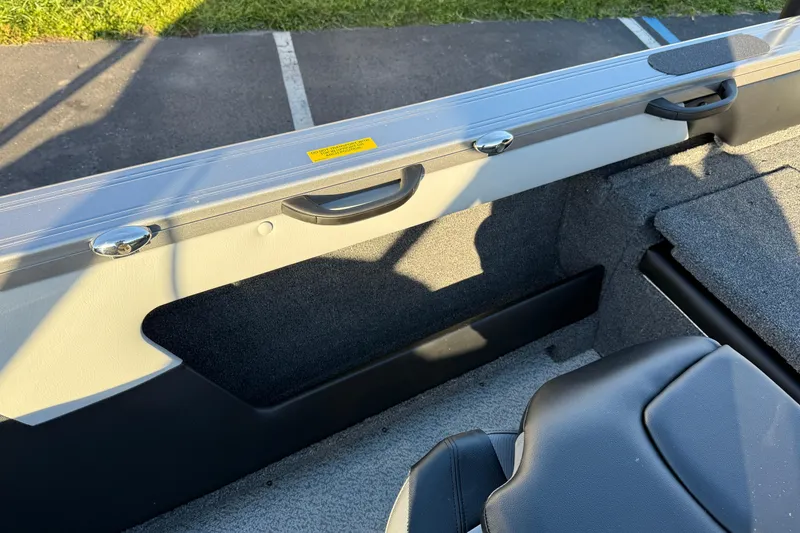 Slide: The Image of Interior view of 2026 Crestliner 1850 Super Hawk boat, featuring seating and storage. - 19