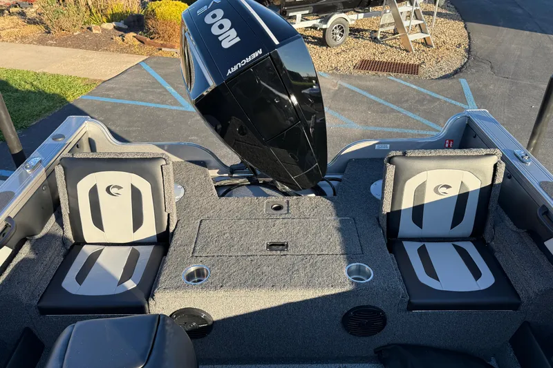 Slide: The Image of 2026 Crestliner 1850 Super Hawk boat interior with Mercury engine and seating. - 21