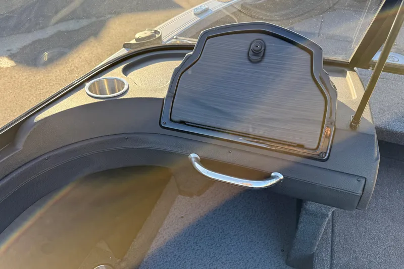 Slide: The Image of 2026 Crestliner 1850 Super Hawk dashboard with storage compartment and cup holder. - 6