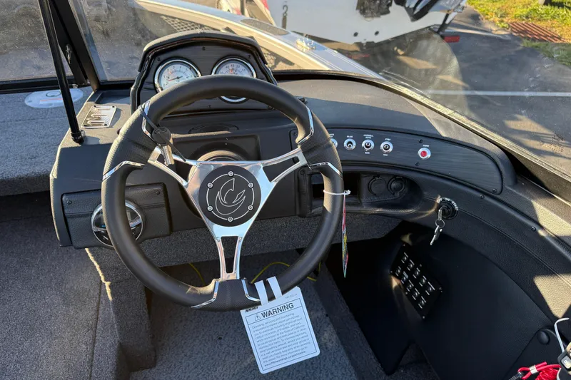 Slide: The Image of 2026 Crestliner 1850 Super Hawk dashboard with steering wheel and control panel. - 8