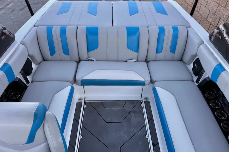 Slide: The Image of 2023 Malibu Wakesetter 21 LX interior with blue and gray seating arrangement. - 17