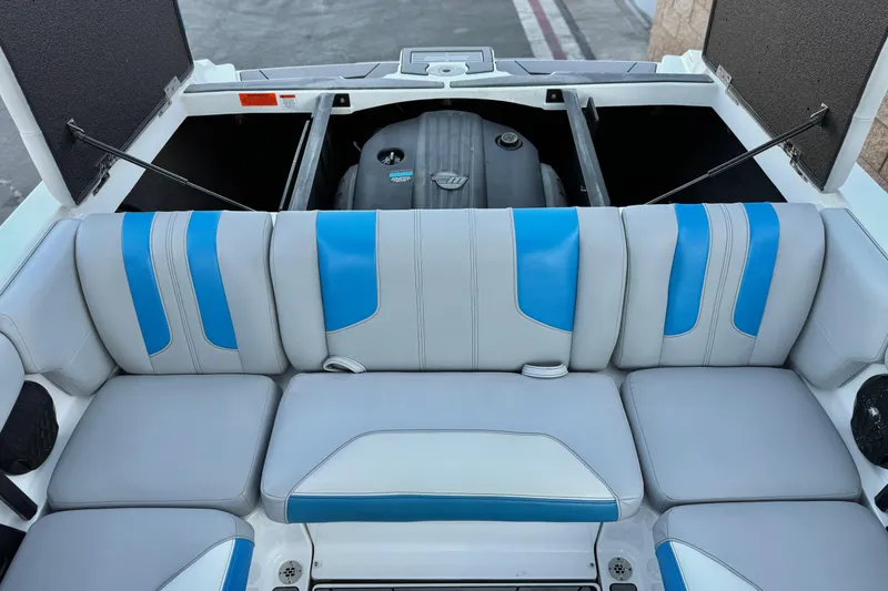 Slide: The Image of 2023 Malibu Wakesetter 21 LX boat interior with blue and gray seating. - 19