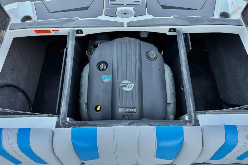 Slide: The Image of 2023 Malibu Wakesetter 21 LX engine compartment with Monsoon engine visible. - 20