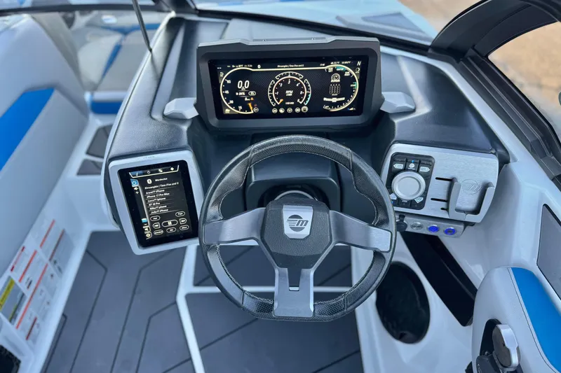 Slide: The Image of 2023 Malibu Wakesetter 21 LX dashboard with modern controls and digital displays. - 26