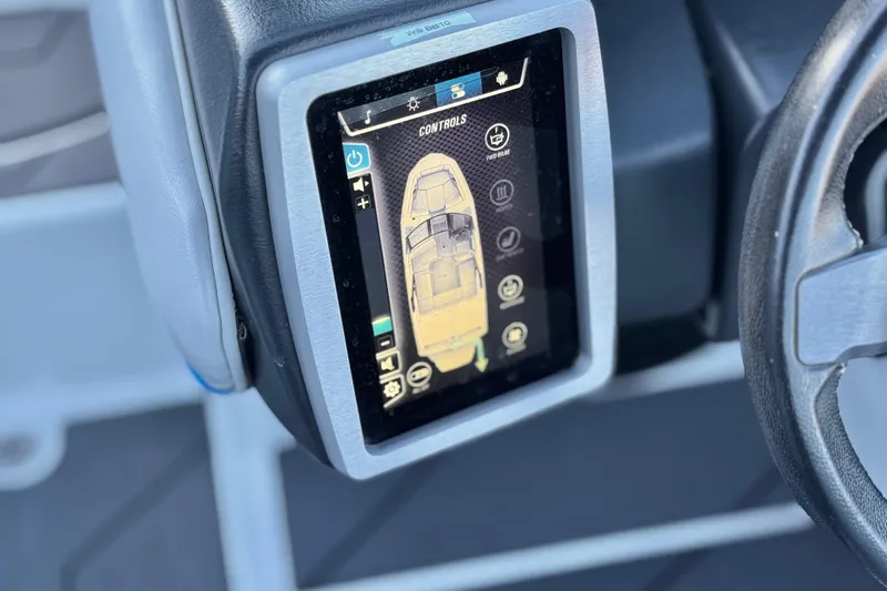 Slide: The Image of 2023 Malibu Wakesetter 21 LX touchscreen control panel, displaying boat settings and controls. - 28