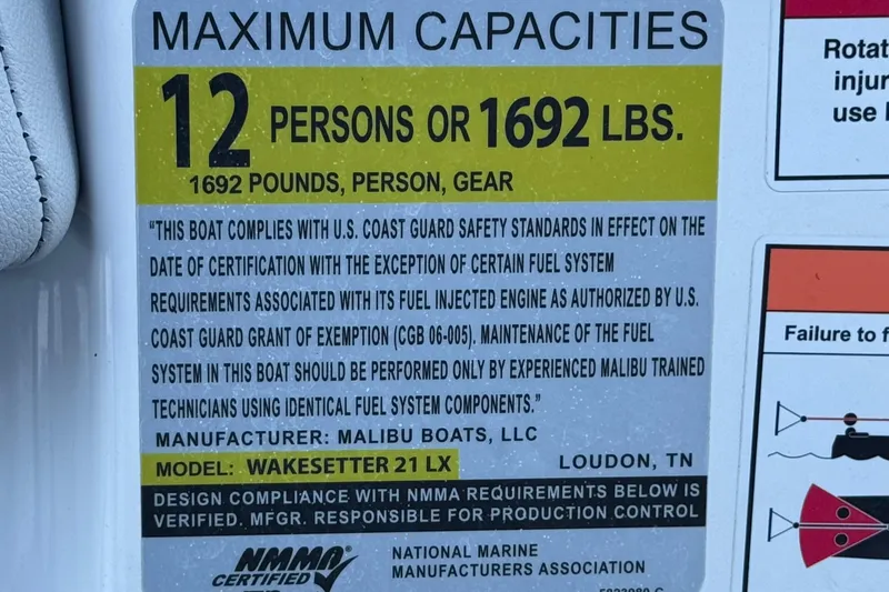 Slide: The Image of 2023 Malibu Wakesetter 21 LX capacity label: 12 persons or 1692 lbs, U.S. Coast Guard compliant. - 37