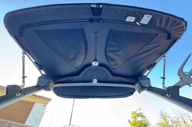 Slide: The Image of 2023 Malibu Wakesetter 21 LX boat canopy viewed from below, showcasing sturdy design. - 8
