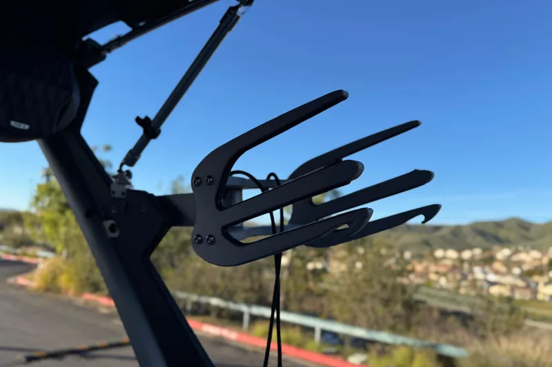 Slide: The Image of 2023 Malibu Wakesetter 21 LX wakeboard rack against scenic background. - 9