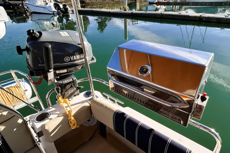 Slide: The Image of 2019 Ranger Tugs R-29 CB with Yamaha motor and Magma grill at marina. - 17