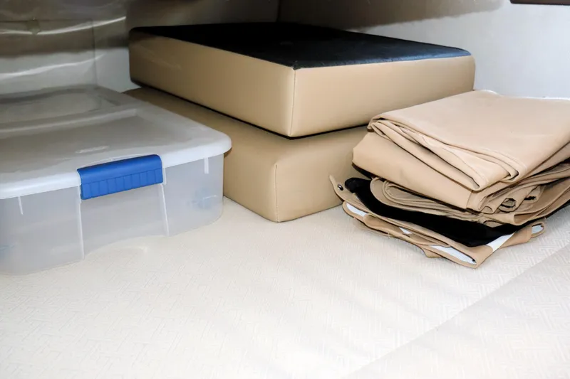 Slide: The Image of Storage area in 2019 Ranger Tugs R-29 CB with cushions and folded covers. - 28