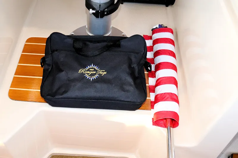 Slide: The Image of Black Ranger Tugs bag and rolled flag on 2019 R-29 CB boat deck. - 29