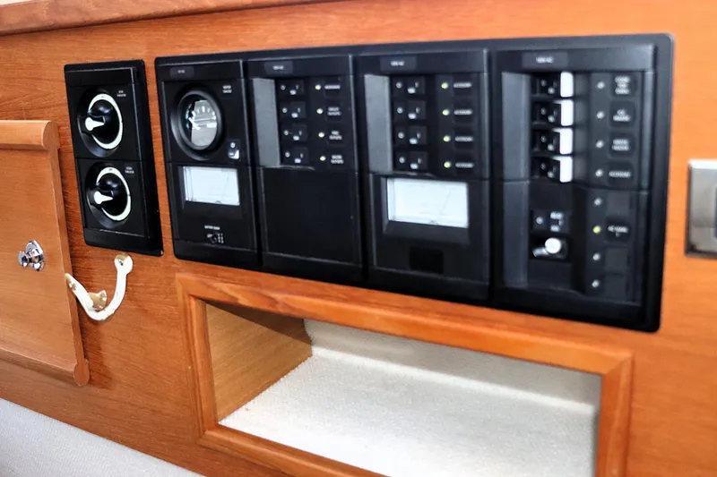 Slide: The Image of Control panel of 2019 Ranger Tugs R-29 CB boat, featuring switches and gauges. - 33