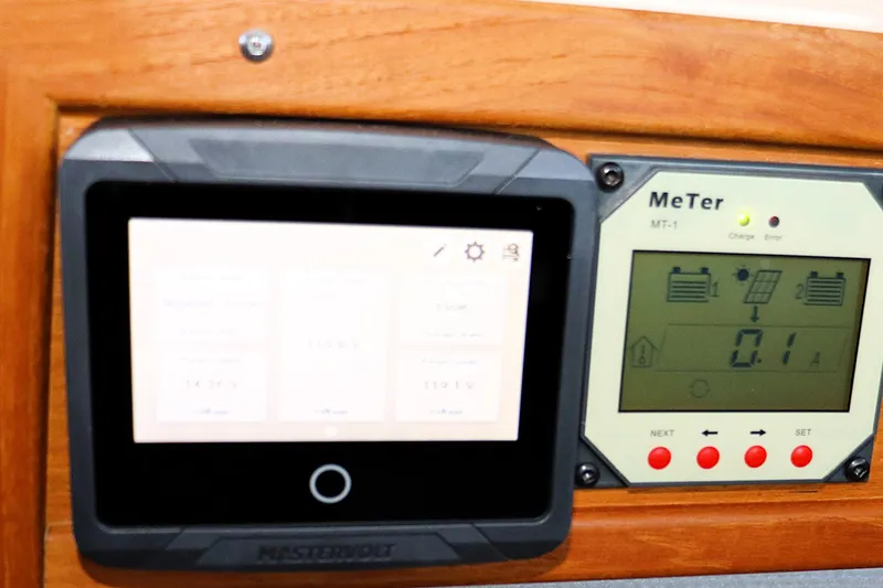 Slide: The Image of Control panel of a 2019 Ranger Tugs R-29 CB boat, featuring Mastervolt and MeTer displays. - 34