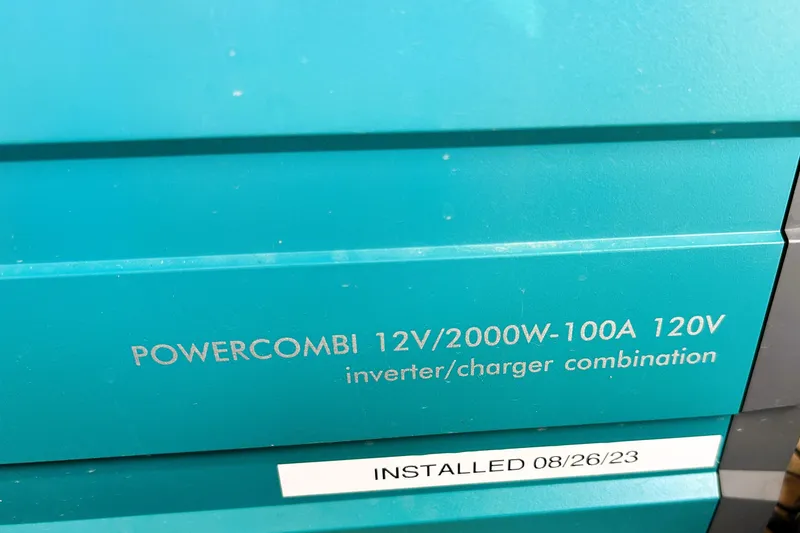 Slide: The Image of PowerCombi 12V/2000W-100A inverter/charger on 2019 Ranger Tugs R-29 CB, installed 08/26/23. - 35