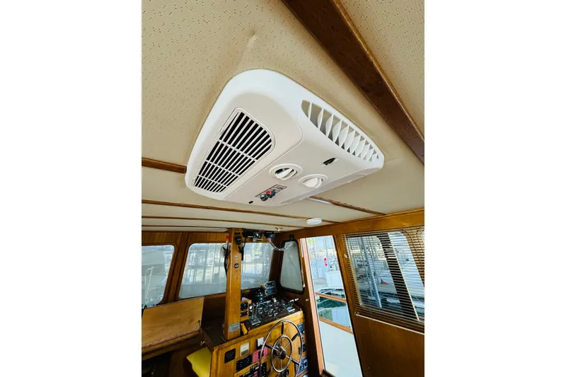 Slide: The Image of 1978 Californian 42 LRC boat interior with ceiling air vent and wooden paneling. - 31