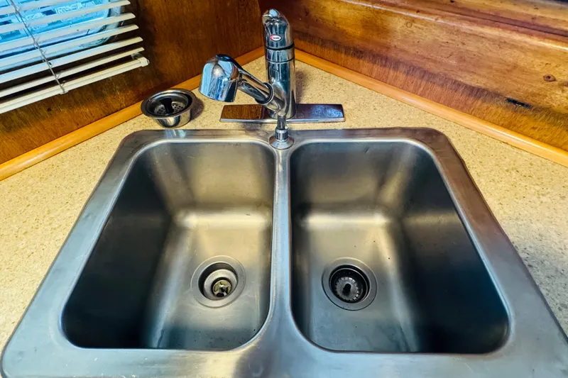 Slide: The Image of Stainless steel double sink with modern faucet in 1978 Californian 42 LRC boat kitchen. - 37