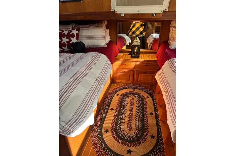 Slide: The Image of Cozy 1978 Californian 42 LRC cabin interior with twin beds and nautical decor. - 39