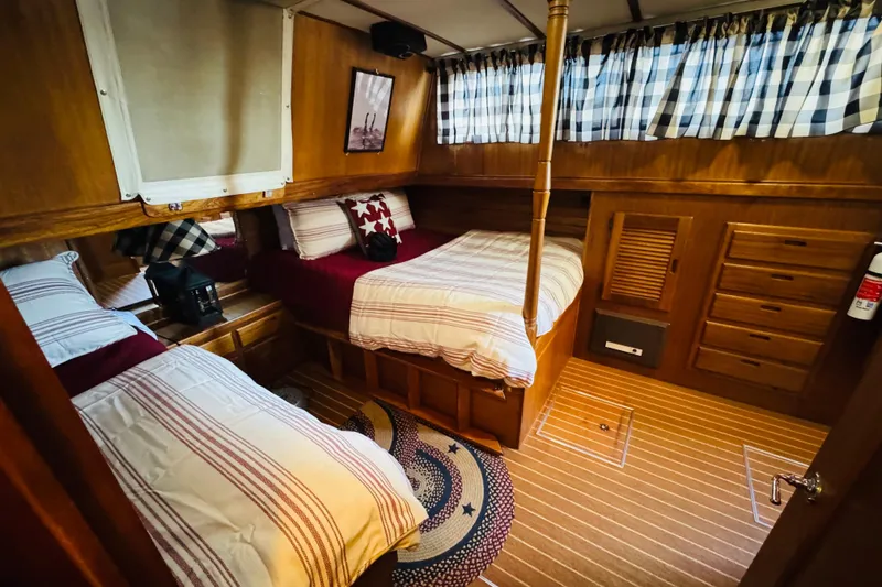 Slide: The Image of Cozy cabin interior of 1978 Californian 42 LRC with twin beds and nautical decor. - 41