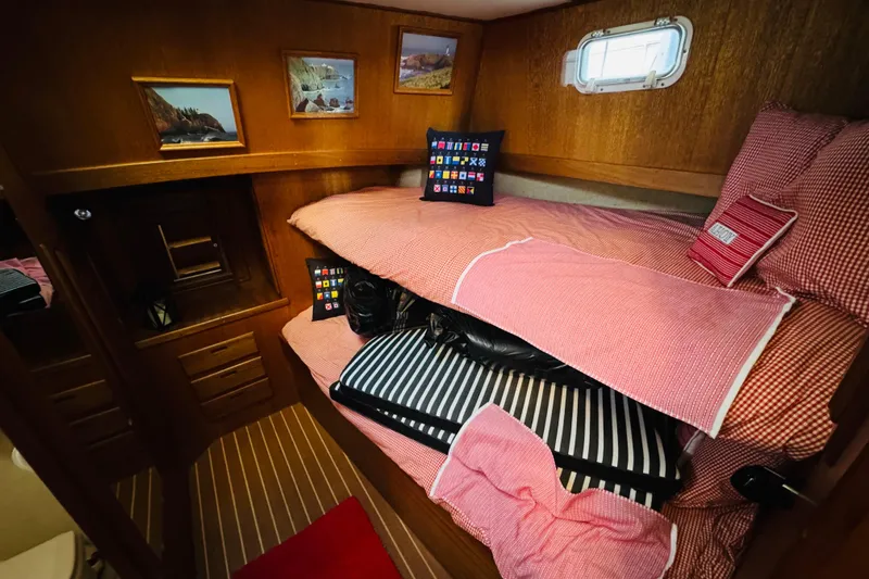 Slide: The Image of Cozy cabin interior of 1978 Californian 42 LRC with bunk beds and nautical decor. - 43