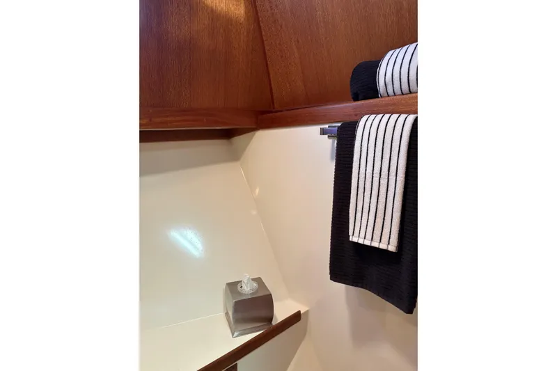 Slide: The Image of 1978 Californian 42 LRC yacht bathroom with wooden accents and striped towels. - 47