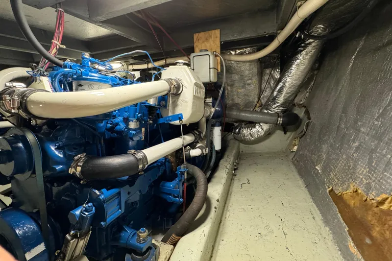 Slide: The Image of Engine room of a 1978 Californian 42 LRC yacht, showcasing detailed machinery. - 59