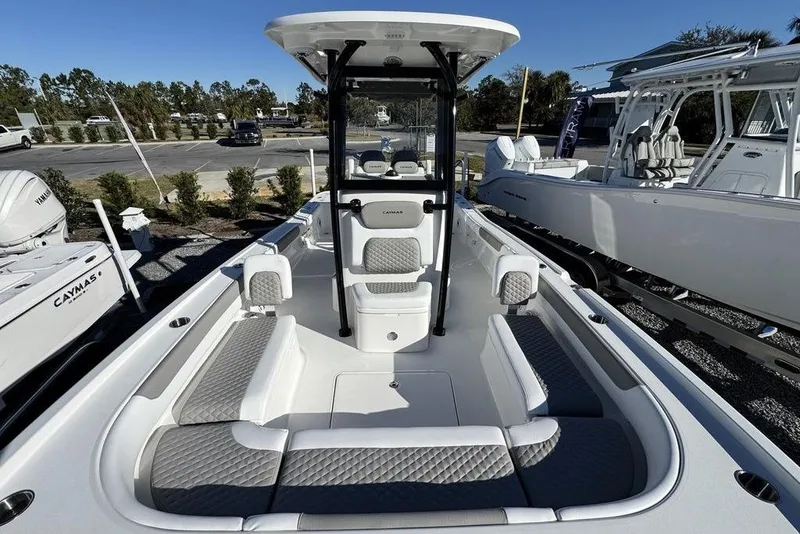 Slide: The Image of 2026 Caymas 281 HB boat interior with cushioned seating and modern design. - 11