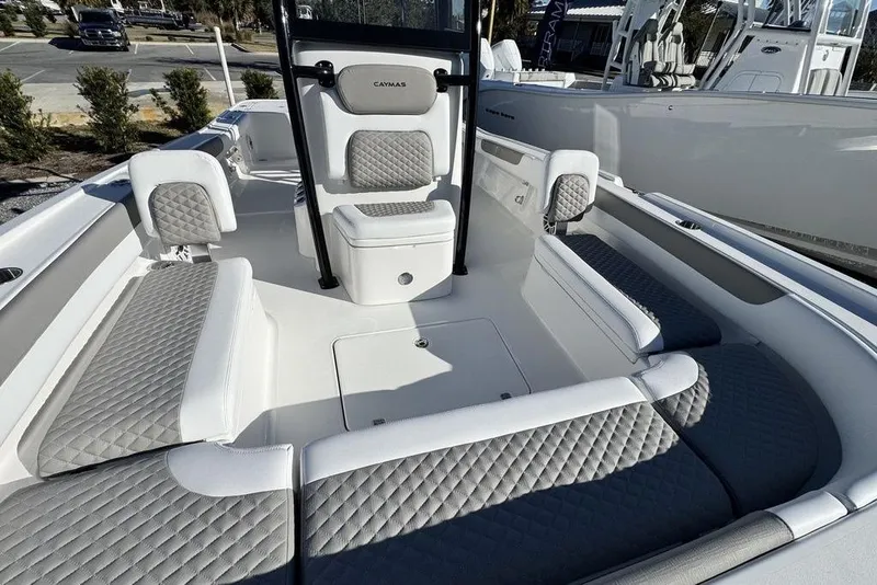 Slide: The Image of 2026 Caymas 281 HB boat interior with gray quilted seating and modern design. - 12