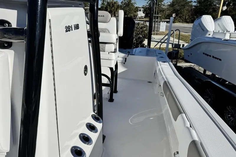 Slide: The Image of 2026 Caymas 281 HB boat interior with seating and rod holders. - 16