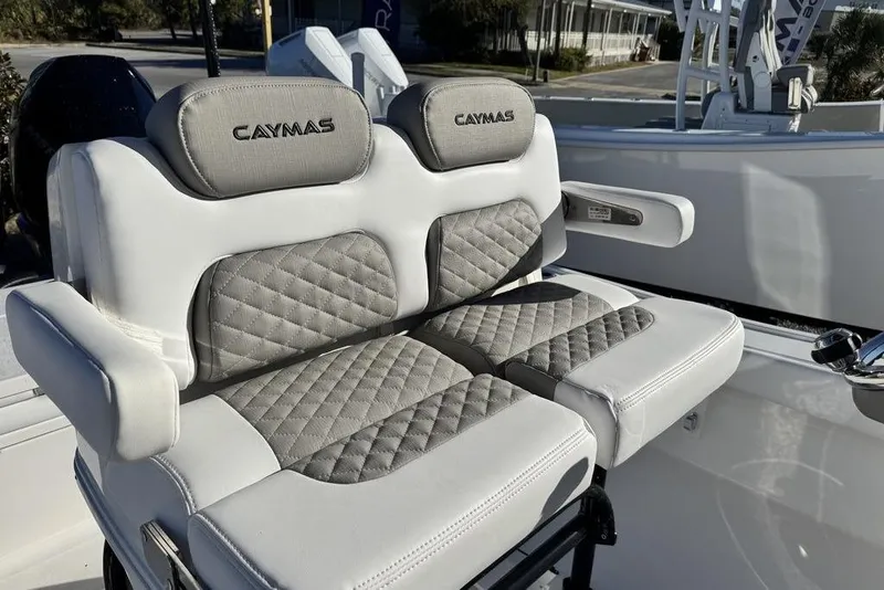 Slide: The Image of Luxurious seating on 2026 Caymas 281 HB boat with quilted upholstery and armrests. - 20