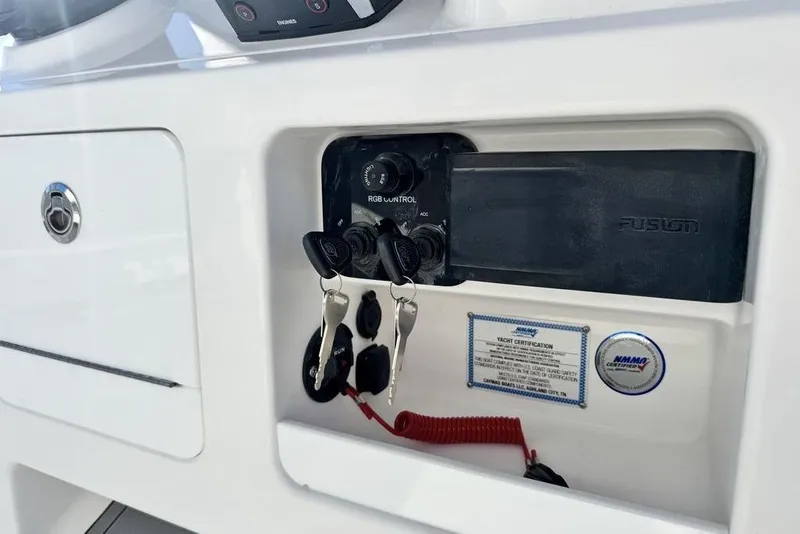 Slide: The Image of 2026 Caymas 281 HB boat dashboard with keys and control panel. - 22