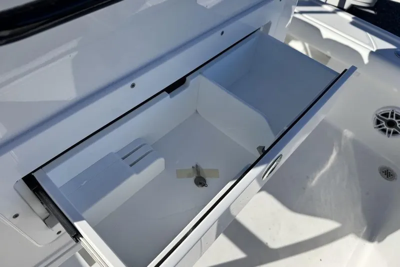 Slide: The Image of Open storage compartment on 2026 Caymas 281 HB boat, showcasing interior design. - 29