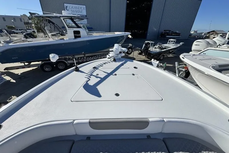 Slide: The Image of 2026 Caymas 281 HB boat displayed at Grander Marine dealership. - 9