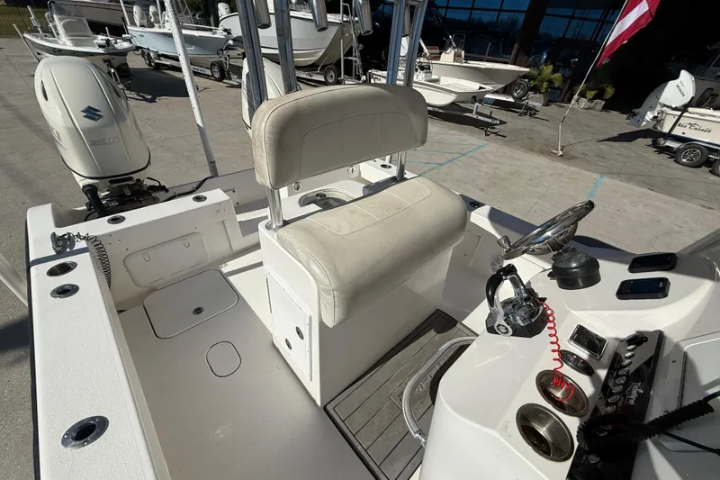 Slide: The Image of 2020 Tideline 235 Hybrid boat interior with steering console and seating. - 13