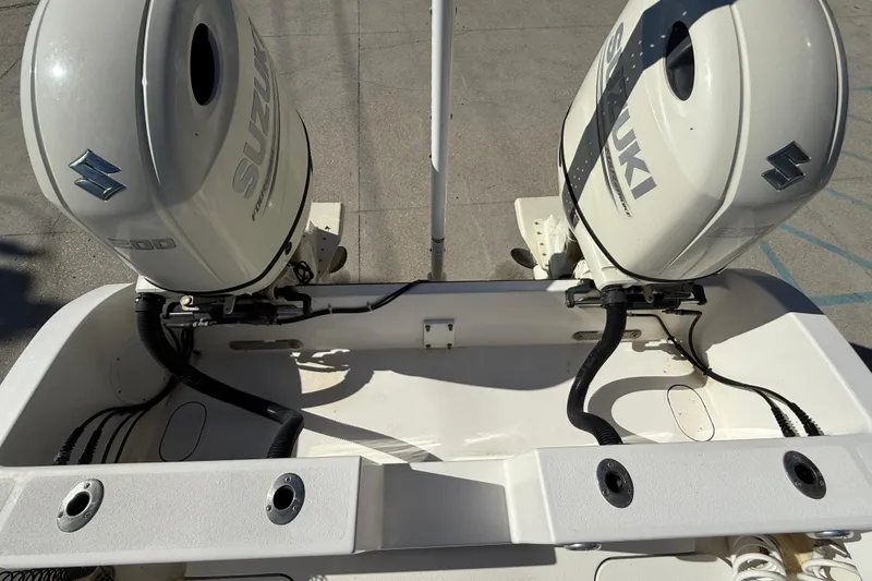 Slide: The Image of 2020 Tideline 235 Hybrid boat with dual Suzuki outboard engines. - 15