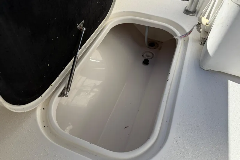 Slide: The Image of Open storage compartment on 2020 Tideline 235 Hybrid boat. - 20