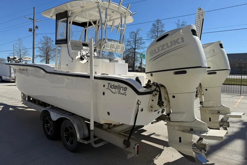 Slide: The Image of 2020 Tideline 235 Hybrid boat with dual Suzuki engines on a trailer. - 5