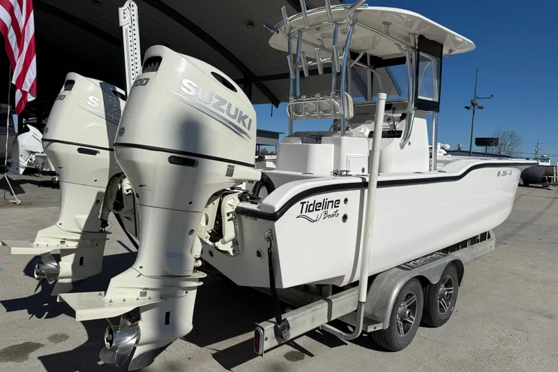 Slide: The Image of 2020 Tideline 235 Hybrid boat with dual Suzuki outboard motors on a trailer. - 7