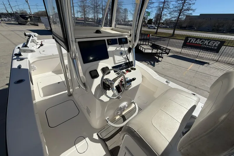 Slide: The Image of 2020 Tideline 235 Hybrid boat interior with steering console and seating. - 9