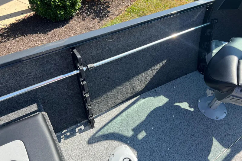 Slide: The Image of Interior of 2026 Crestliner 1650 Hawk boat showing seating and rod holder. - 13