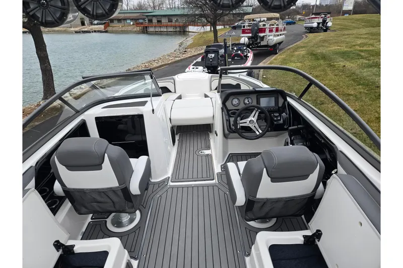 Slide: The Image of 2017 Yamaha Boats 212 Limited S interior with sleek seating and modern dashboard. - 10